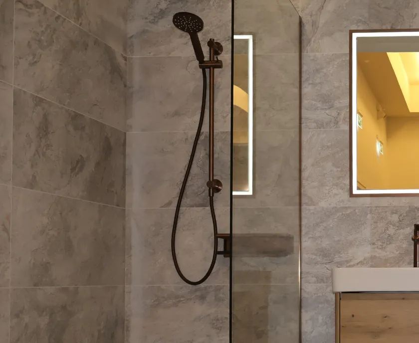 Warm Metal Details & Floating Vanity